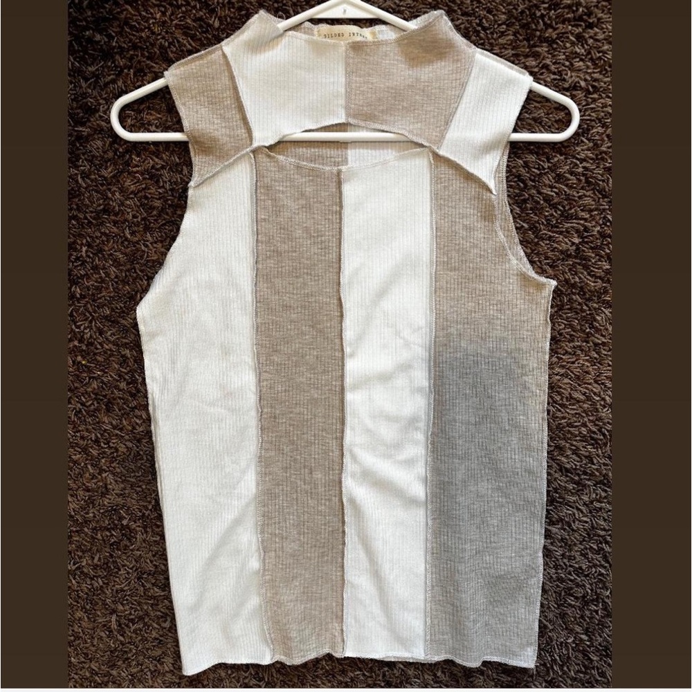 Crème and white striped tank with a hole in the chest area